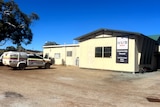 A police car outside a country pub in the Wheatbelt.