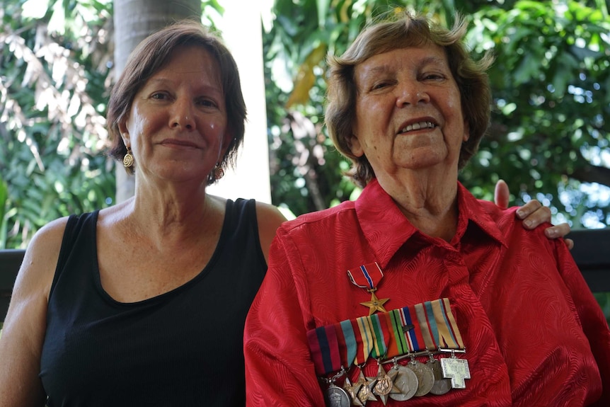 Betty and Ngaire Bowditch with Jim Bowditch's war medals.