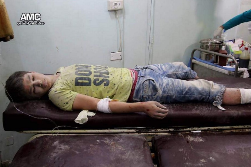 Boy injured in airstrike lies on hospital bed
