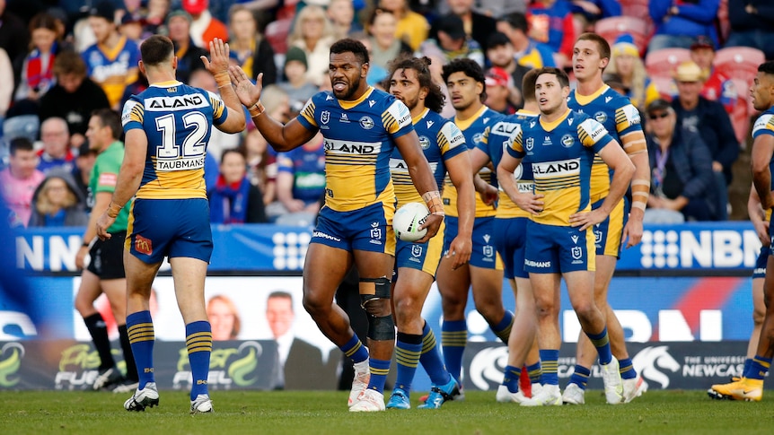 Knights players celebrate their win after the NRL Round 4 match between the Newcastle  Knights and the Canberra Raiders at McDonald Jones Stadium in Newcastle,  Sunday, March 26, 2023. (AAP Image/Darren Pateman)