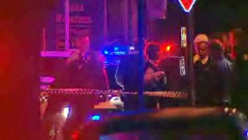 Police gather at the scene in Bankstown in Sydney's south-west