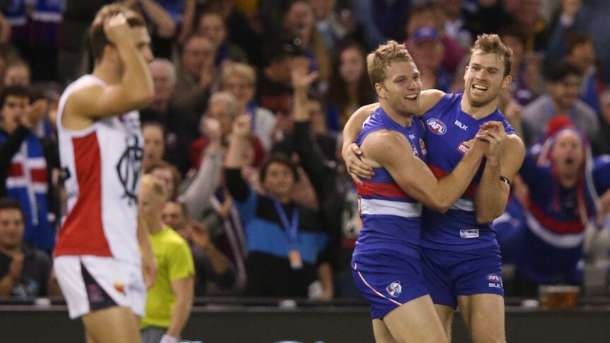 Western Bulldogs players celebrate a goal against Melbourne at Docklands on August 16, 2015.