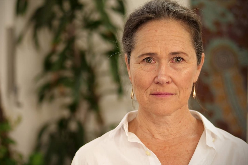 Sally Stevenson standing in a room inside Centre with a determined look on her face.