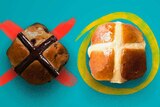 A chocolate hot cross bun crossed out beside a circled traditional hot cross bun to depict whether the Easter treat is good.