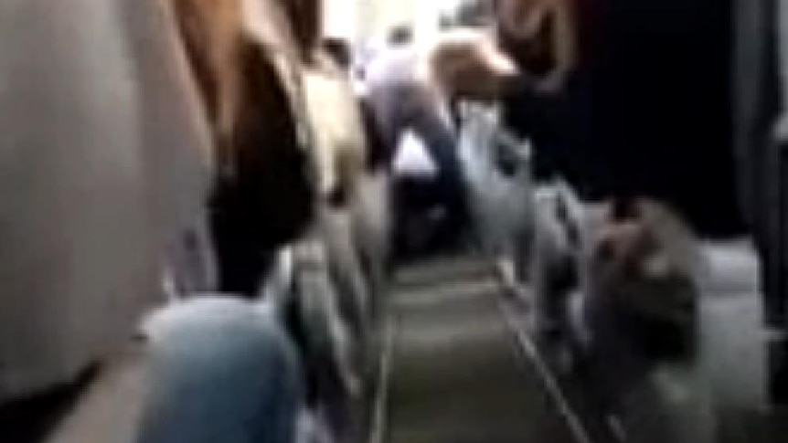 Passengers restrain captain