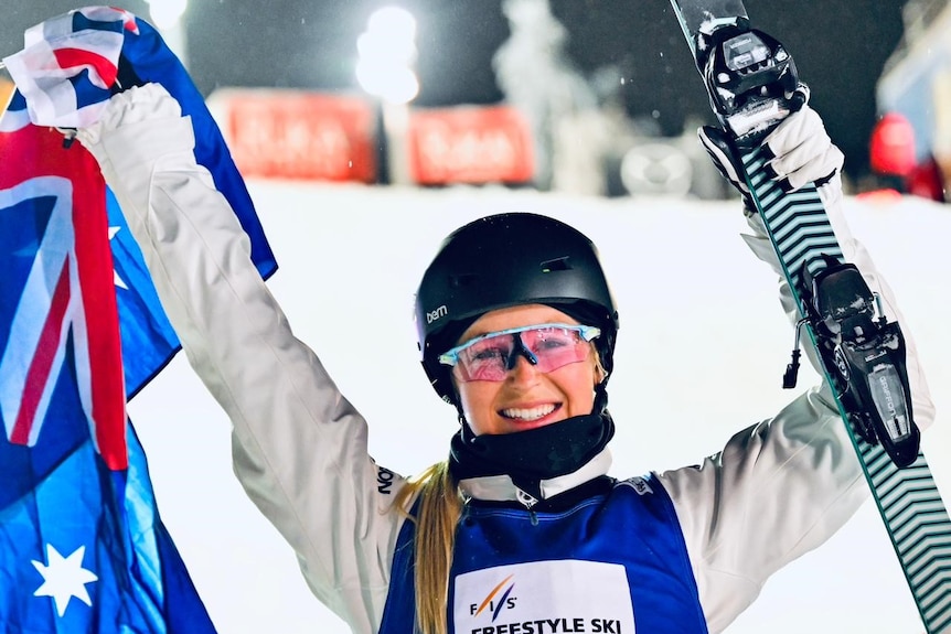 Danielle Scott holds up a flag