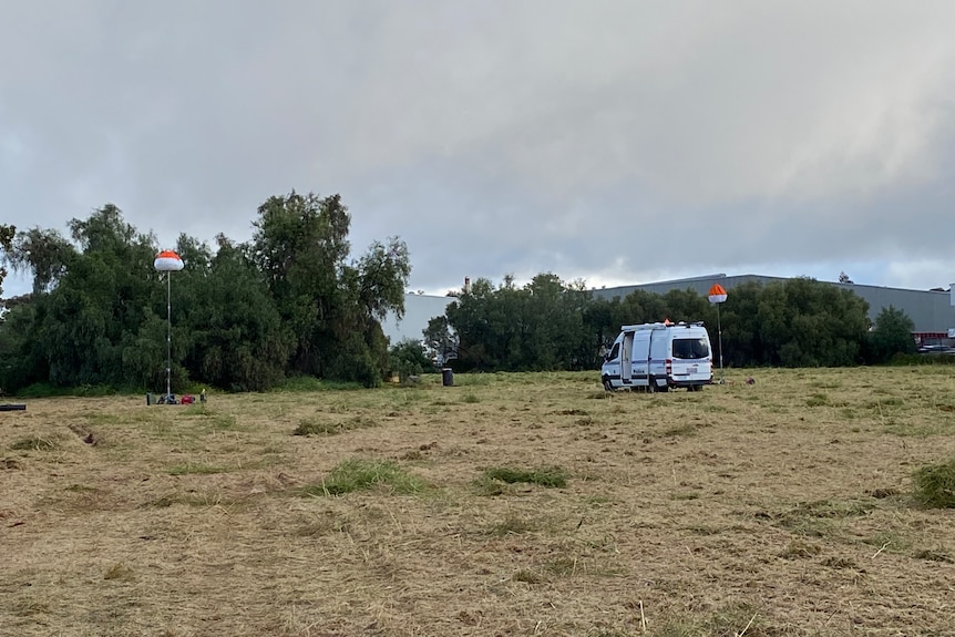 A police van on an empty paddock