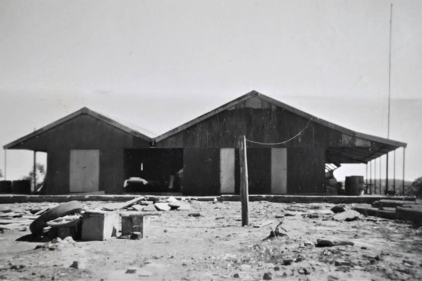 a monochrome image of an old homestead on a cattle station