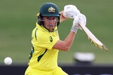 An Australian player hits to the off side during the Women's Cricket World Cup match against Pakistan.