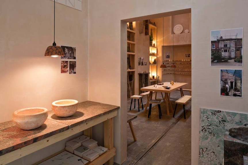 Handmade bowls sit on a bench in the Granby Workshop.