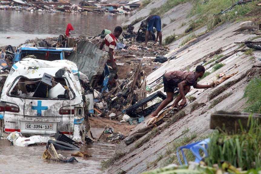 Rescuers try to remove valuables