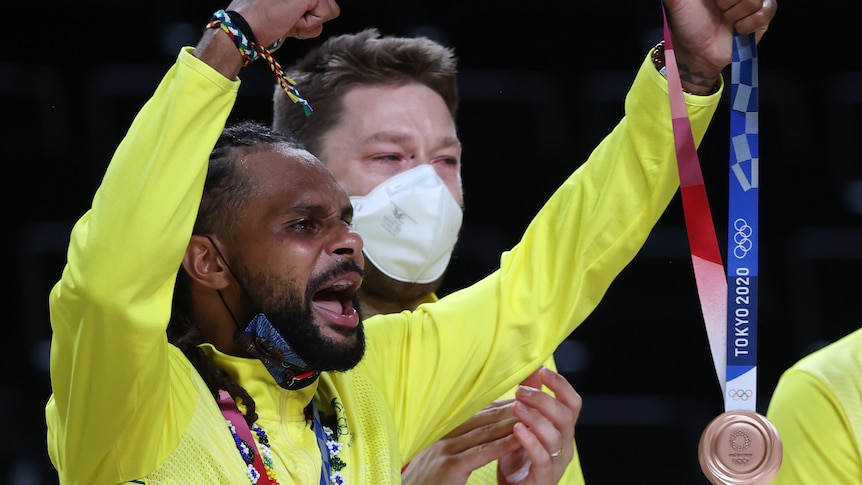 Patty Mills celebrates with the bronze medal