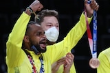 Patty Mills celebrates with the bronze medal