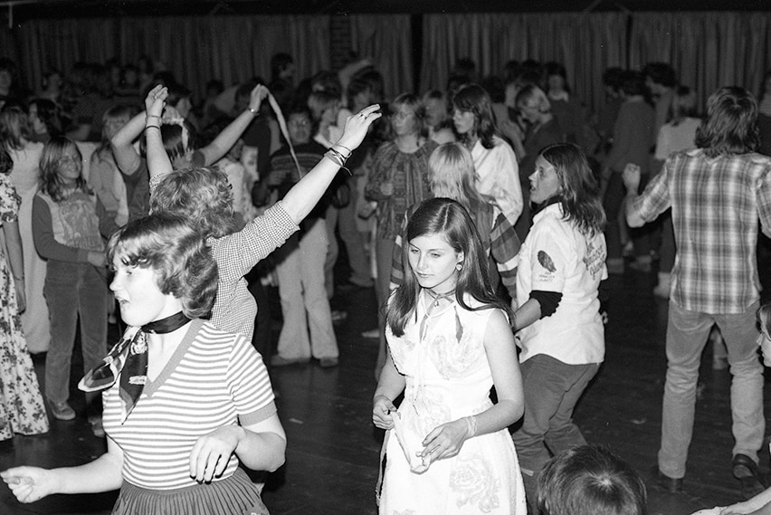 Young people dancing in a hall.