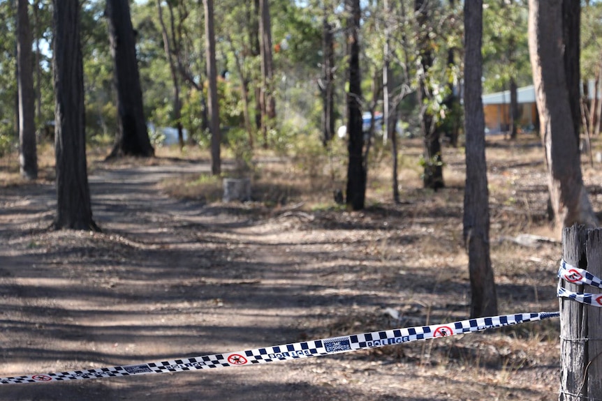 Police tape outside the property at Yandaran where a man was allegedly stabbed to death.