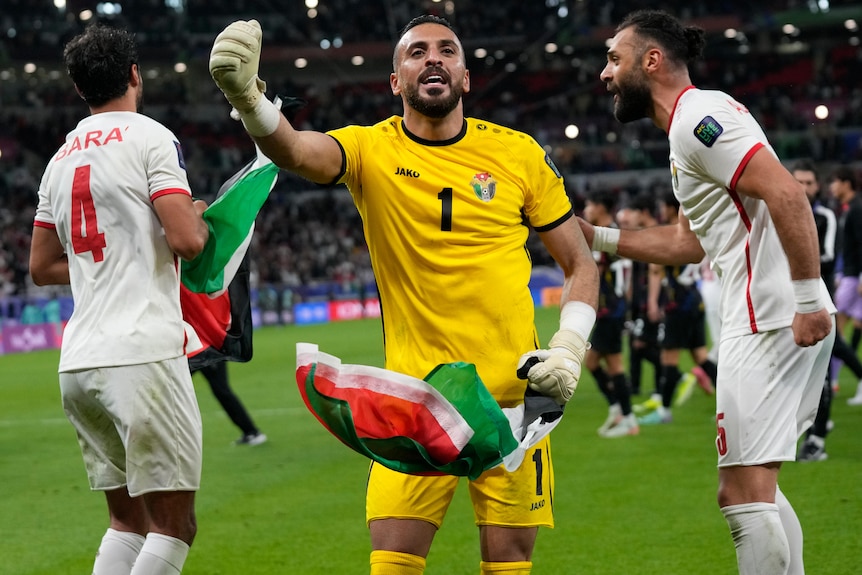 Jordan players celebrate defeating South Korea in men's Asian Cup semifinal.