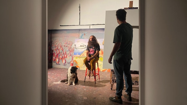 Ben Quilty sketching a portrait of Costa.
