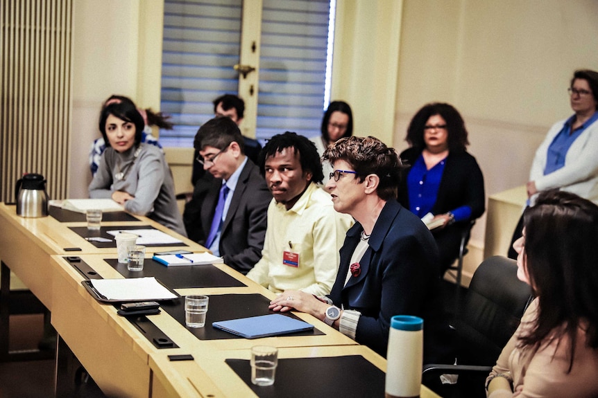 Refugee Abdul Aziz Muhamat addresses a group at the UN Human Rights Council.