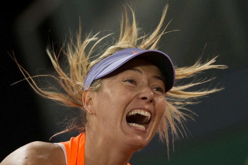 Maria Sharapova reacts in her match against Eugenie Bouchard at the Madrid Open on May 8, 2017.