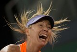 Maria Sharapova reacts in her match against Eugenie Bouchard at the Madrid Open on May 8, 2017.