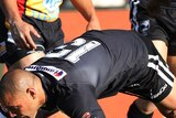 New Zealand's Jeremy Smith crashes over in his side's 14-try romp of the Kumuls.