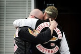 Grieving Hell's Angels members mourn during the funeral of Anthony Zervas