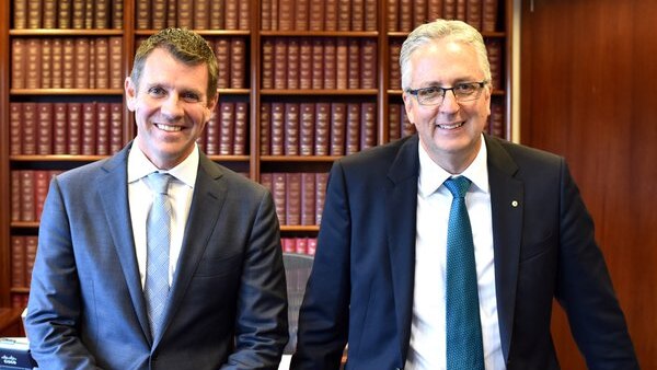 NSW Premier Mike Baird and former ABC MD Mark Scott in an office.