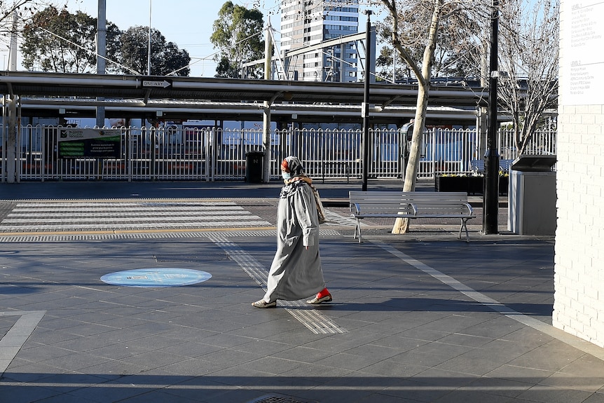 a woman walking along a street