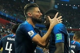 Olivier Giroud kisses Samuel Umtiti after scoring against Belgium
