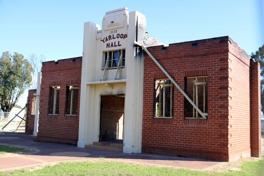 An external shot of the town hall, which still shows signs of damage by fire.