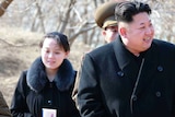 Kim Jo-yong follows her brother Kim Jong-un, who is smiling.