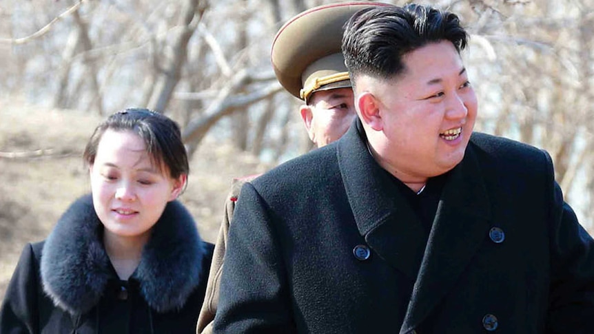 Kim Jo-yong follows her brother Kim Jong-un, who is smiling.