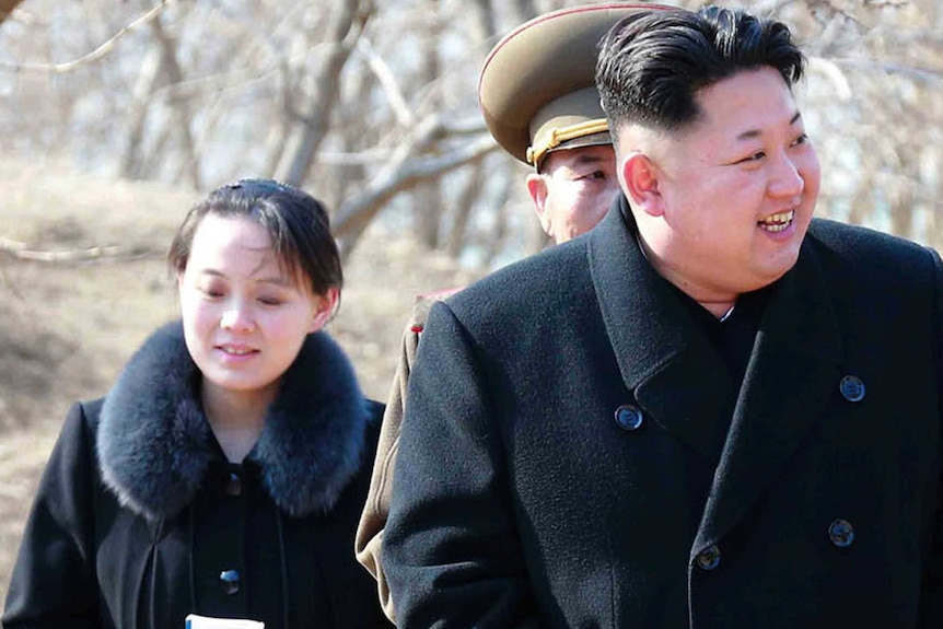 Kim Jo-yong follows her brother Kim Jong-un, who is smiling.