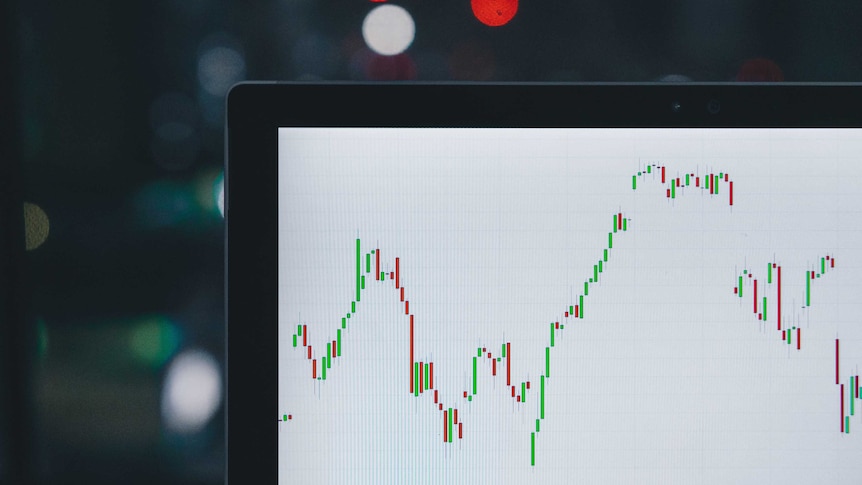 A chart of a volatile financial asset is seen on a laptop screen.
