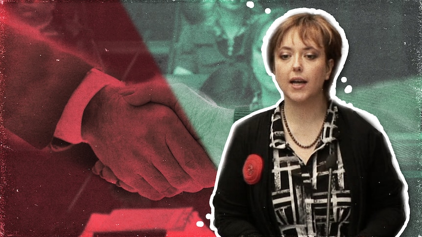 Former Tasmanian premier Lara Giddings speaks with a graphic of two hands shaking behind her.