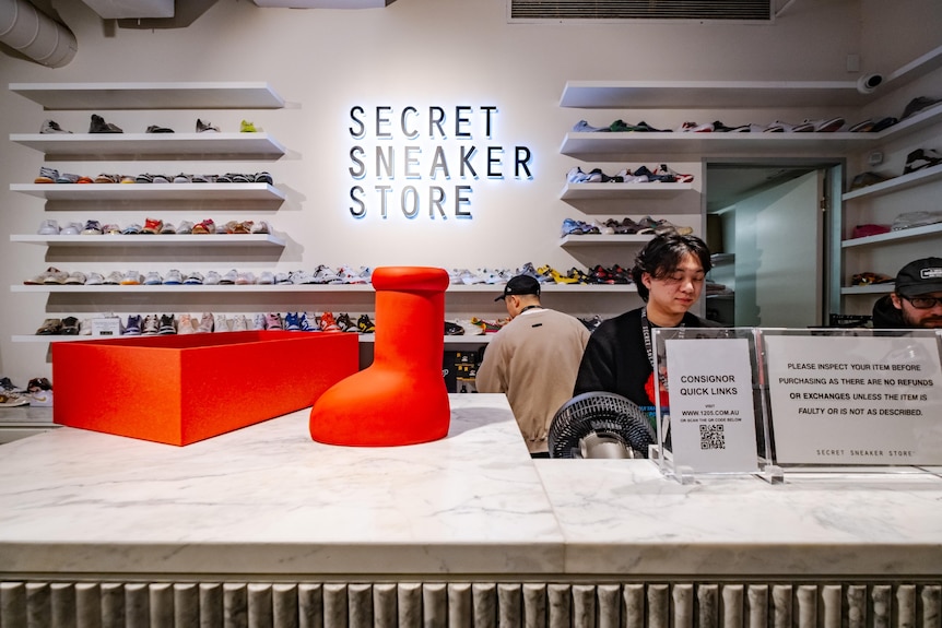 A photo showing a red boot on a table at the Melbourne sneaker store.