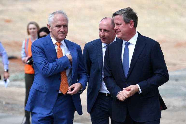 Mr Turnbull walks with Mr Howarth and Mr Nicholls.