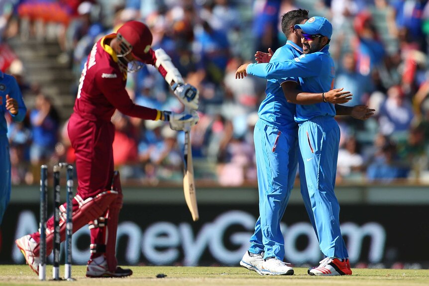 India celebrates the wicket of Denesh Ramdin