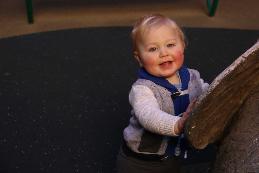 Quinn smiles and his cheeks are rosy.