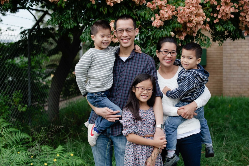 Eddie Woo with his family