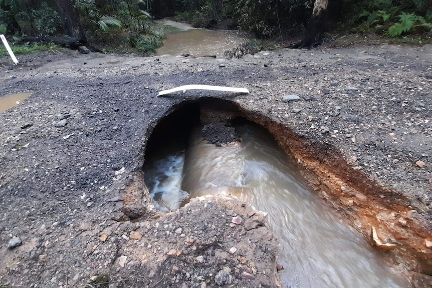 Water runs under a bitumen road