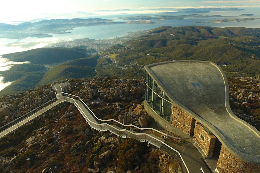 View looking from above kunanyi/Mt Wellington observation deck and walkways towards Hobart, via drone.
