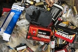 Birds-eye view of assortment of batteries used to power household and workplace devices