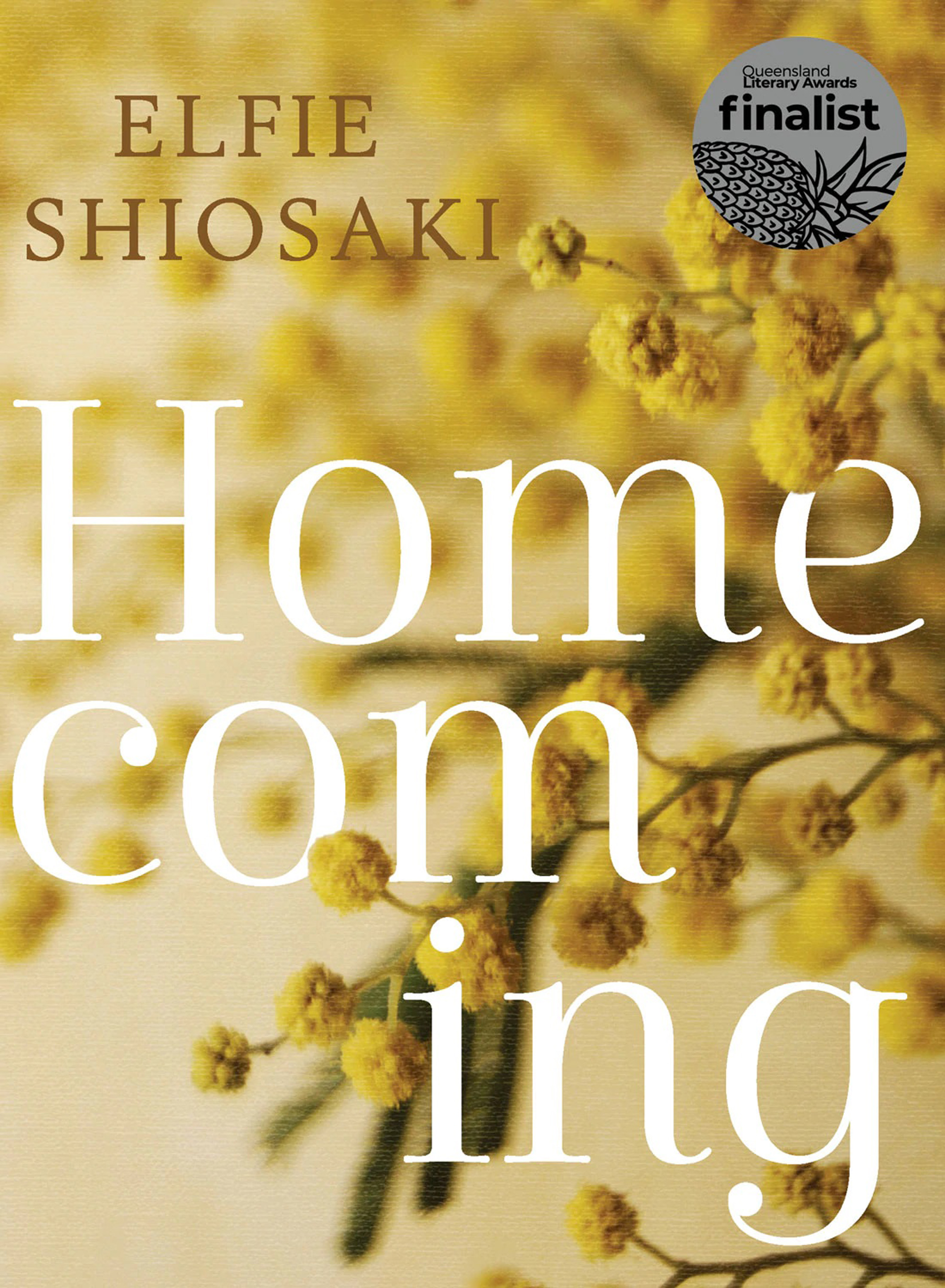 A book cover for Homecoming by Elfie Shiosaki. It features a picture of golden wattle. 
