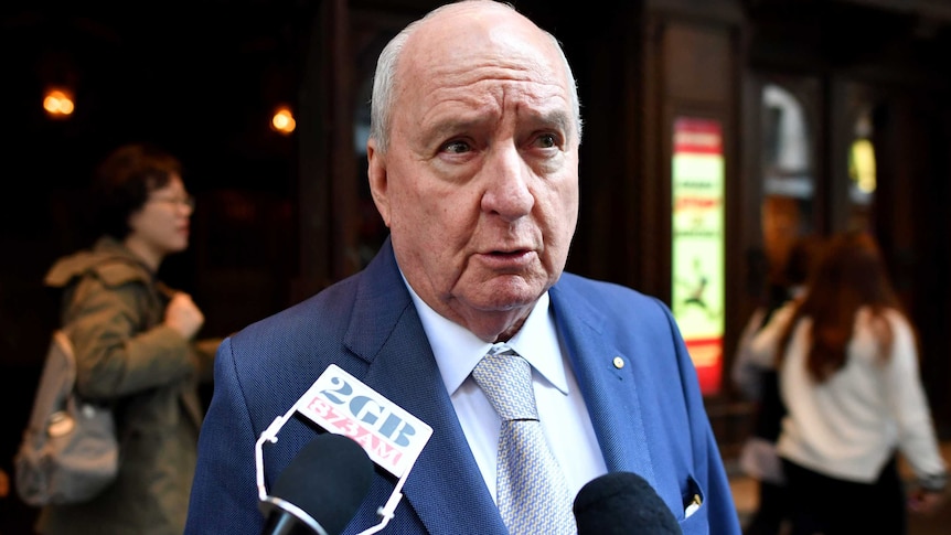 Alan Jones speaks to media