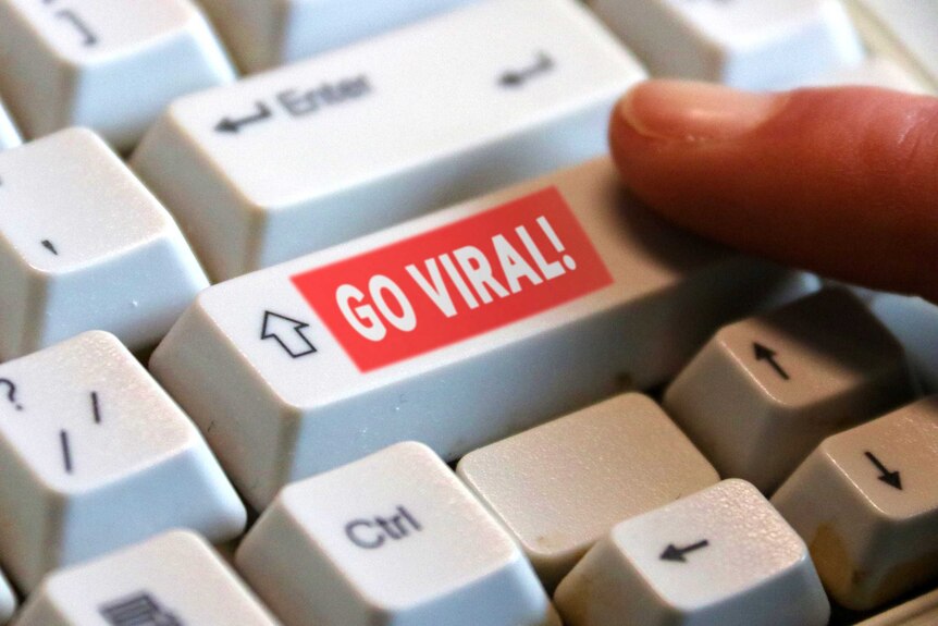 A keyboard with a super-imposed 'go viral' button on the shift key
