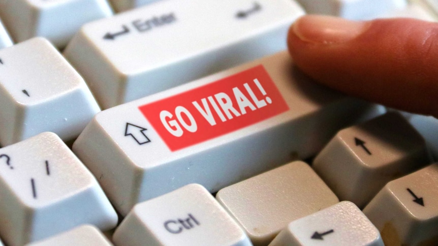 A keyboard with a super-imposed 'go viral' button on the shift key