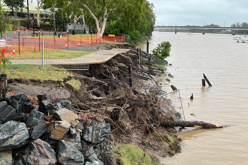 A footpath beside a river collapsed with the land underneath it washed away
