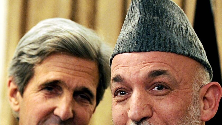 LtoR US Senator John Kerry and Afghan President Hamid Karzai speak at a press conference