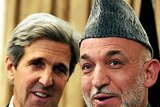 LtoR US Senator John Kerry and Afghan President Hamid Karzai speak at a press conference